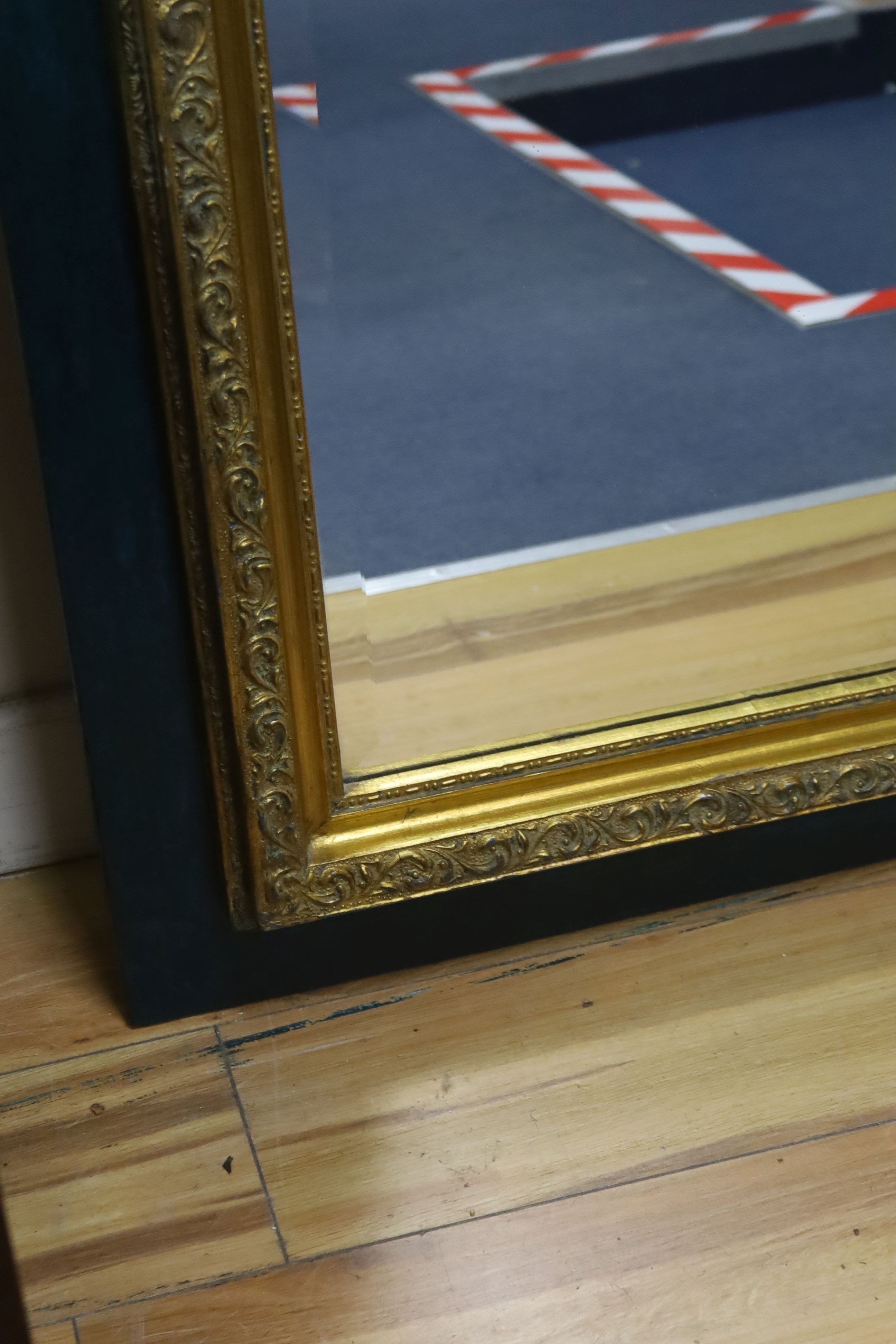A 19th century French overmantel gilt and gesso mirror with musical themed emblem over on blue background, width 114cm, height 172cm